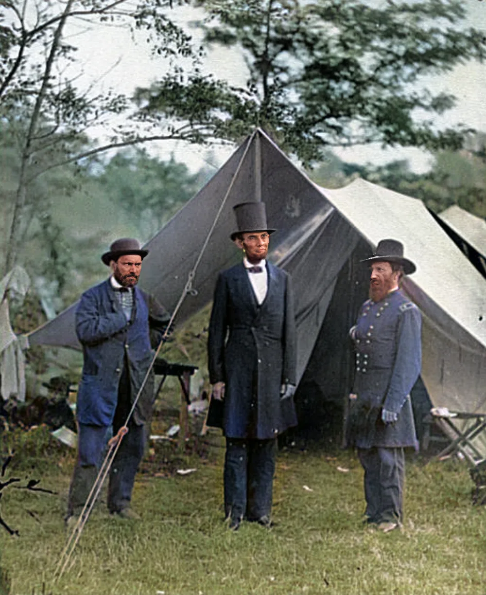 The same photograph restored and colourised: uniforms in blue, grass and canvas in natural tones